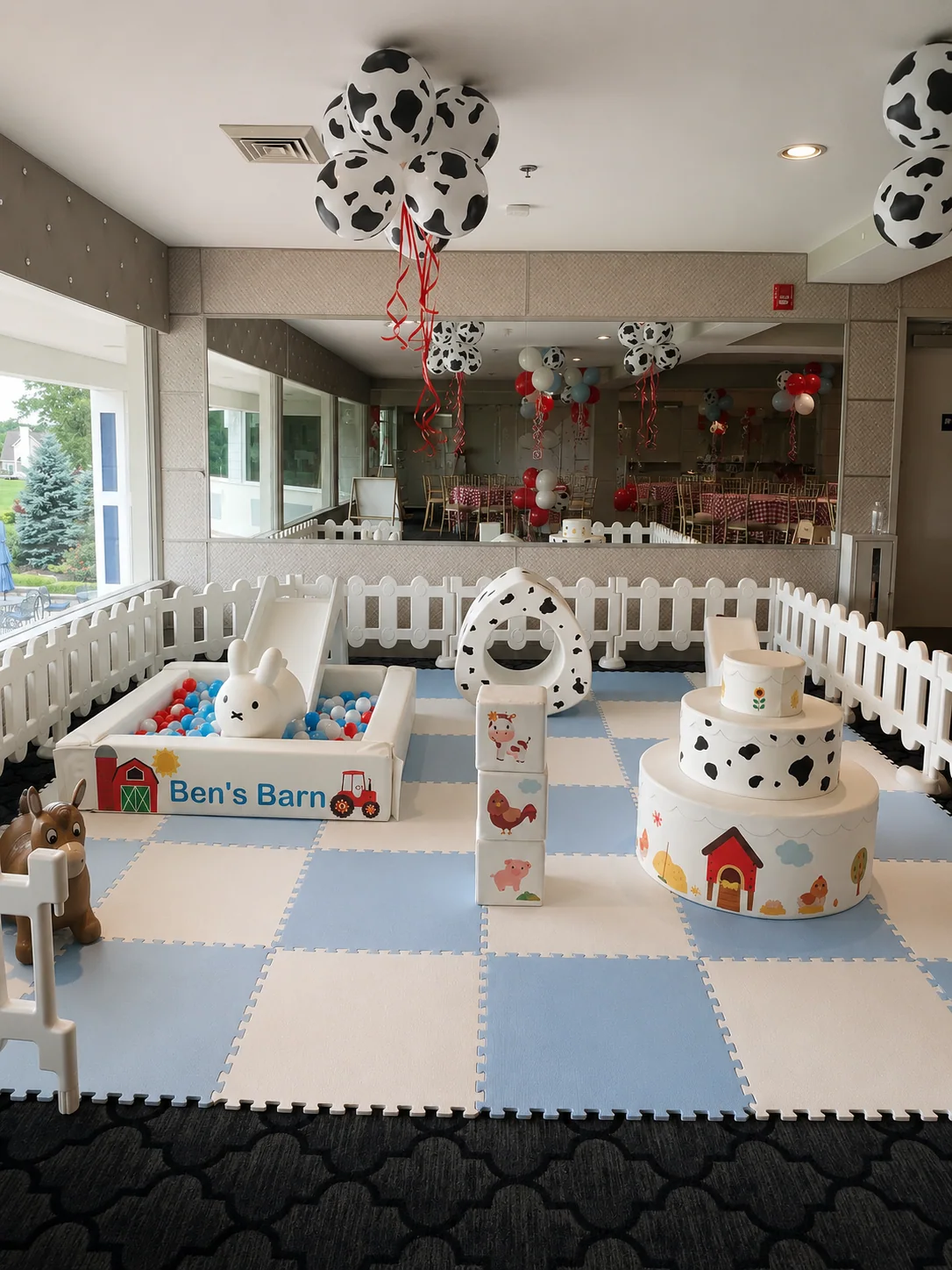 Farm-themed indoor soft play birthday setup with custom vinyl