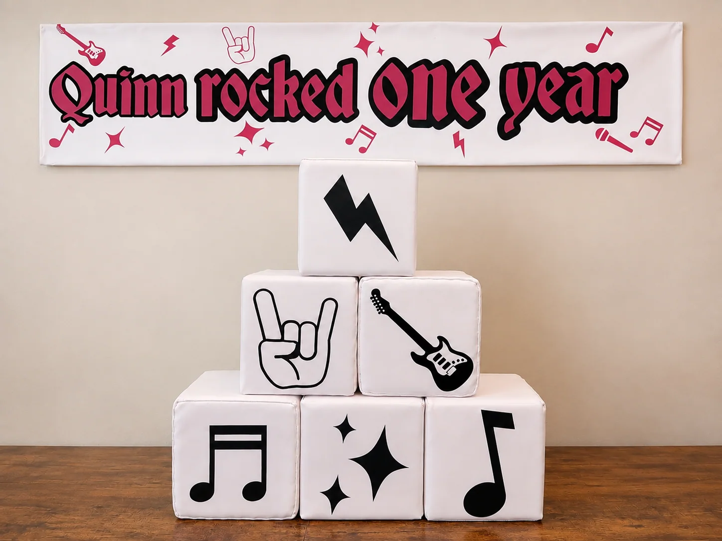 Guitar-themed custom vinyl shown on soft play equipment and a rocker