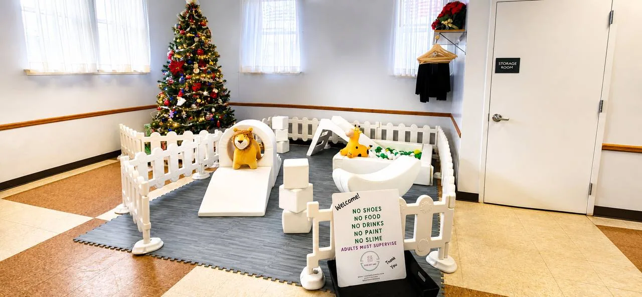 Holiday indoor soft play setup with gray flooring